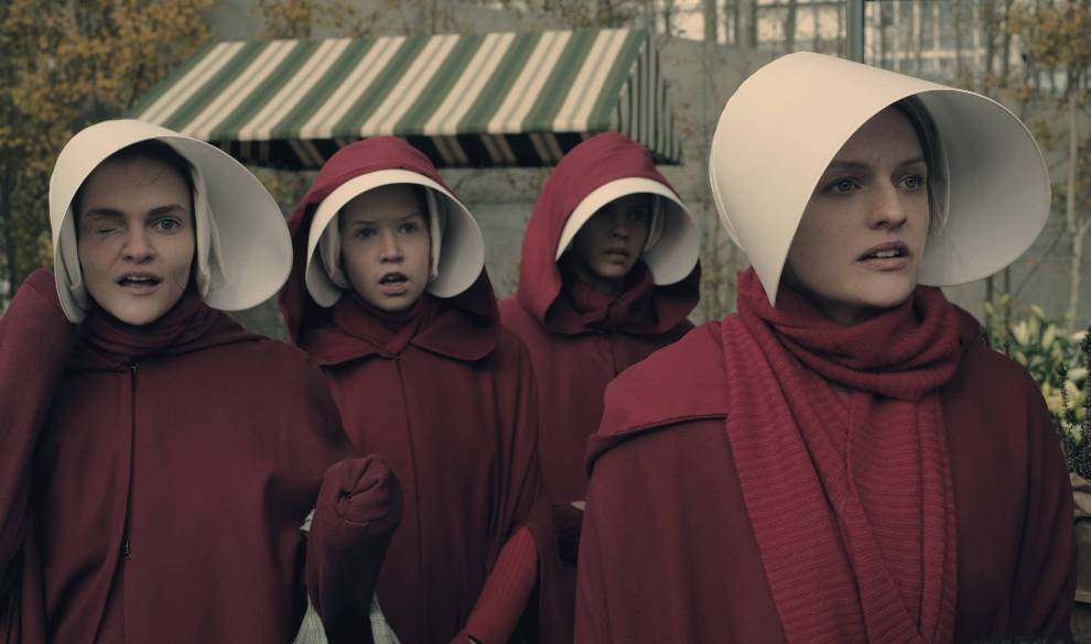 The Handmaid's Tale -- Faithful -- Episode 105 -- Serena Joy makes Offred a surprising proposition. Offred remembers the unconventional beginnings of her relationship with her husband. Janine (Madeline Brewer), left and Offred (Elisabeth Moss), right, shown. (Photo by: George Kraychyk/Hulu) $!The Handmaid's Tale -- Faithful -- Episode 105 -- Serena Joy makes Offred a surprising proposition. Offred remembers the unconventional beginnings of her relationship with her husband. Janine (Madeline Brewer), left and Offred (Elisabeth Moss), right, shown. (Photo by: George Kraychyk/Hulu)