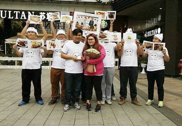 $!Pic shows: The couple with a group of friends. A jealous boyfriend deliberately fattened up his girlfriend to put off any love rivals. Businessman You Pan, 25, met pretty Yan Tai, 20, when she only weighed just over seven stone. But after he took her out regularly for big breakfasts, lunches and dinners she ballooned in weight to a massive 14 stones. And just to be sure no one else took any interest in her, he even woke her up and fed her midnight snacks. The unusual courtship has been happening in in South Chinas Guangdong Province and has been the talk of the town ever since it was reported in local media. The story came out when after two years of dating Tou proposed to Yan, 19, with a chocolate bouquet and a promise to love her and feed her even more. She said yes and when she posted the images online, revealed the reason for the chop okay which quickly became one of the most talked about discussions on Chinese social media platforms. Neighbour Yi Chiang who has known the girl since she was little said: Its hard to believe how much weight Yan has put on but she is still very beautiful. She will make a lovely bride and Im sure they will be very happy together. I dread to think how much they have spent on food but if it makes them happy then why not. (ends)